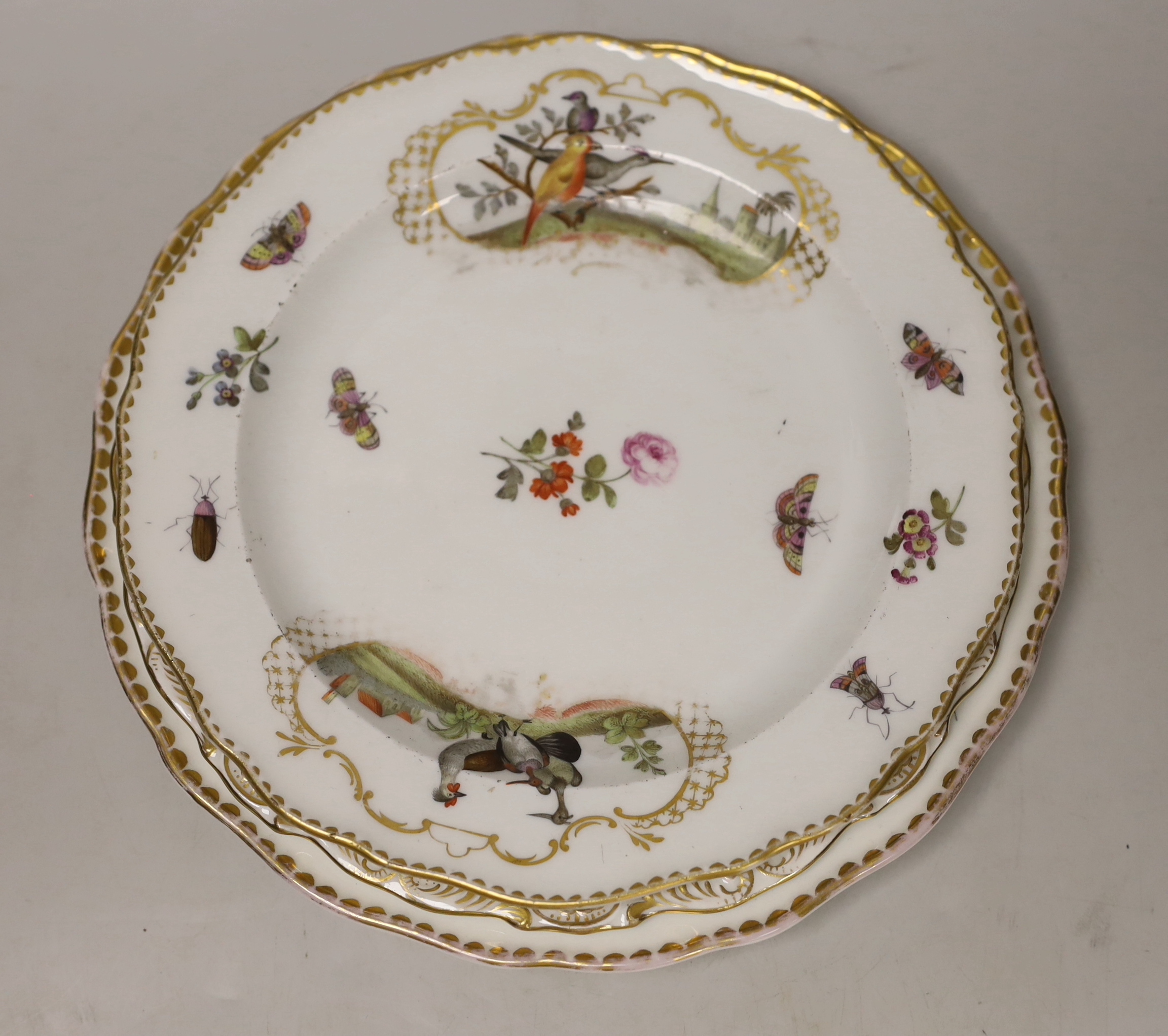 Five 19th century Meissen porcelain items including three plates, a dish and a cup and saucer, most items outside decorated, largest plate 23.5cm